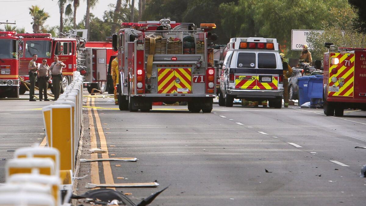 Authorities work at the scene of a fatal crash on Pacific Coast Highway in Malibu in Nov. 29.