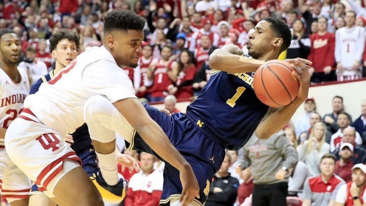 Michigan's Charles Matthews grabs a rebound during Friday's win over Indiana.