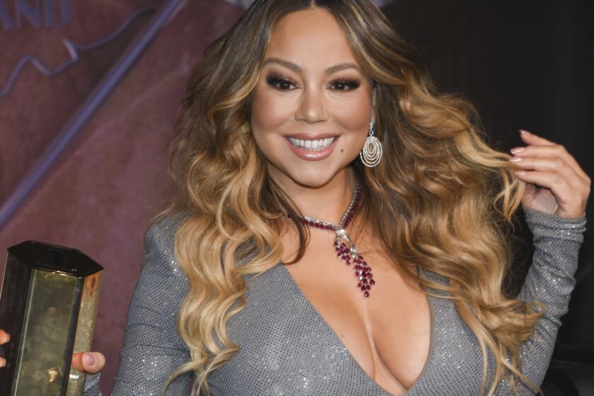 Singer Mariah Carey participates in the ceremonial lighting of the Empire State Building to commemorate the 25th anniversary of the release of her single "All I Want For Christmas Is You" on Tuesday, Dec. 17, 2019, in New York. (Photo by Evan Agostini/Invision/AP)