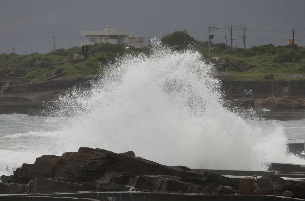 A high wave hits ashore as Typhoon Chanthu approaches to Taiwan in Keelung, New Taipei City, Taiwan, Saturday, Sept. 11, 2021. Taiwan’s weather bureau warned of high winds and heavy rain as Typhoon Chanthu roared toward the island Saturday and said the storm’s center was likely to pass its east coast instead of hitting land. (AP Photo/Chiang Ying-ying)