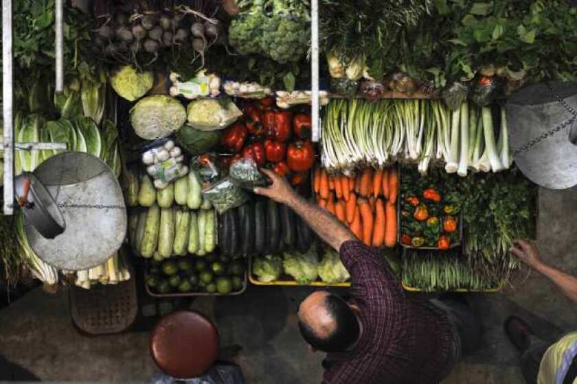 Eat your veggies (and frozen entrees)! Jenny Craig topped Consumer Reports' latest rankings of diet plans. Pictured: a vegetable stand in Caracas, Venezuela.