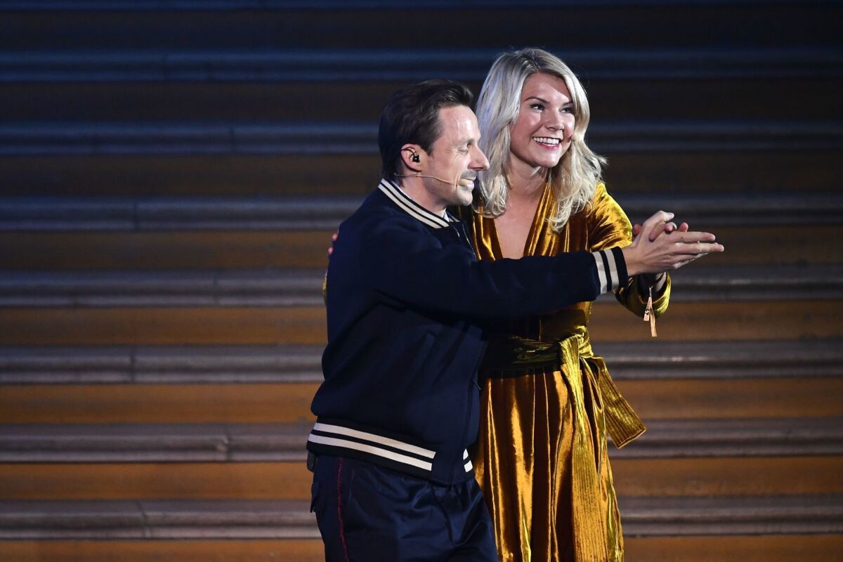 Olympique Lyonnais' Norwegian forward Ada Hegerberg (R) dances with French DJ and producer Martin Solveig after receiving the 2018 FIFA Women's Ballon d'Or award for best player of the year during the 2018 FIFA Ballon d'Or award ceremony at the Grand Palais in Paris on December 3, 2018. - The winner of the 2018 Ballon d'Or will be revealed at a glittering ceremony in Paris on December 3 evening, with Croatia's Luka Modric and a host of French World Cup winners all hoping to finally end the 10-year duopoly of Cristiano Ronaldo and Lionel Messi.