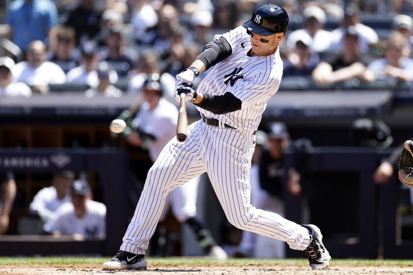 New York Yankees' Anthony Rizzo hits an RBI-single against the San Diego Padres during the third inning of a baseball game Sunday, May 28, 2023, in New York. (AP Photo/Adam Hunger)