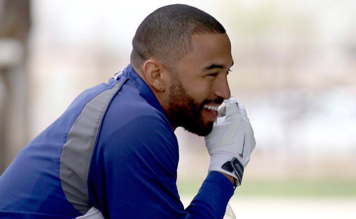Dodgers outfielder Matt Kemp smiles during batting practice at the team's spring-training facility in Glendale, Ariz., on Tuesday. Kemp hopes to see some playing time in Cactus League play before the regular season begins.