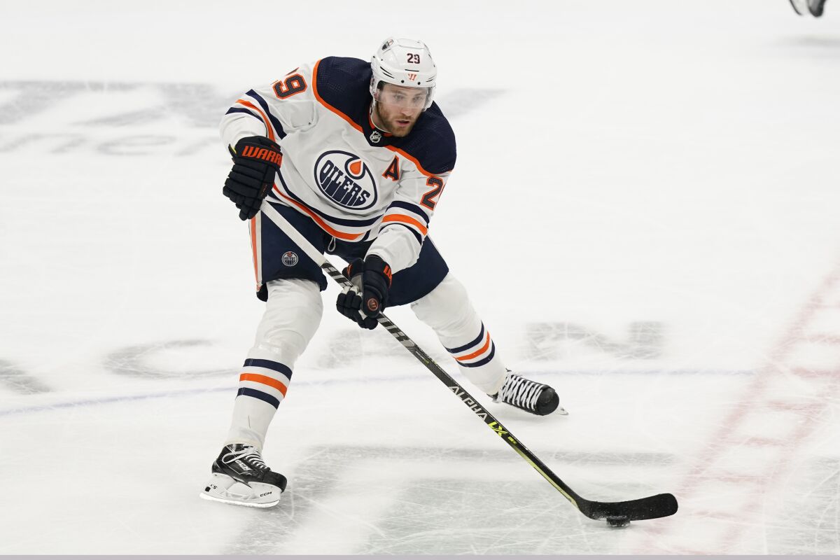 Edmonton Oilers center Leon Draisaitl controls the puck during a game against the Dallas Stars in March.