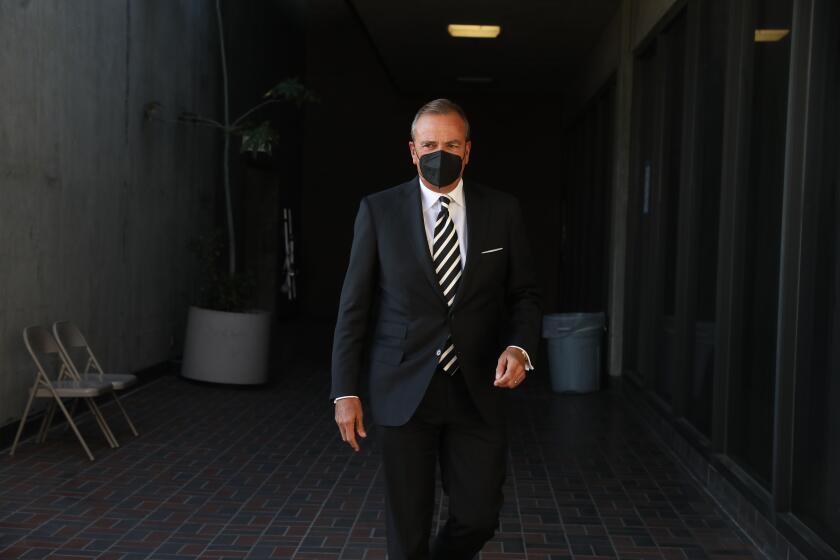 Rick Caruso enter's Piper Tech to file paper work to run for mayor at the city clerks office in Los Angeles.