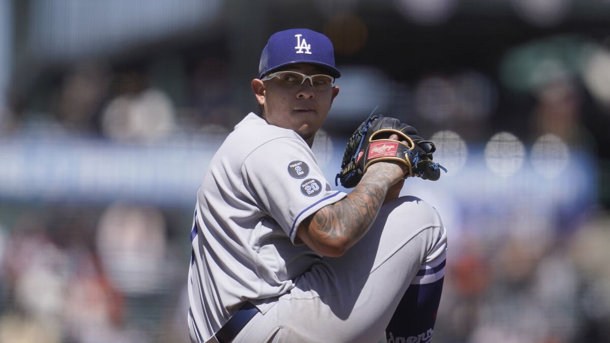 Dodgers pitcher Julio Urías winds up against the San Francisco Giants on Sunday.