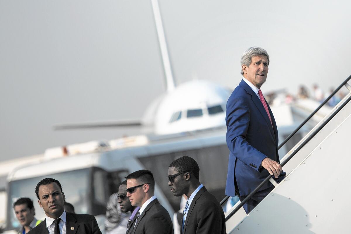 Secretary of State John F. Kerry boards his plane Sept. 13 in Cairo, where he sought Arab support for a regional offensive against Islamic State.