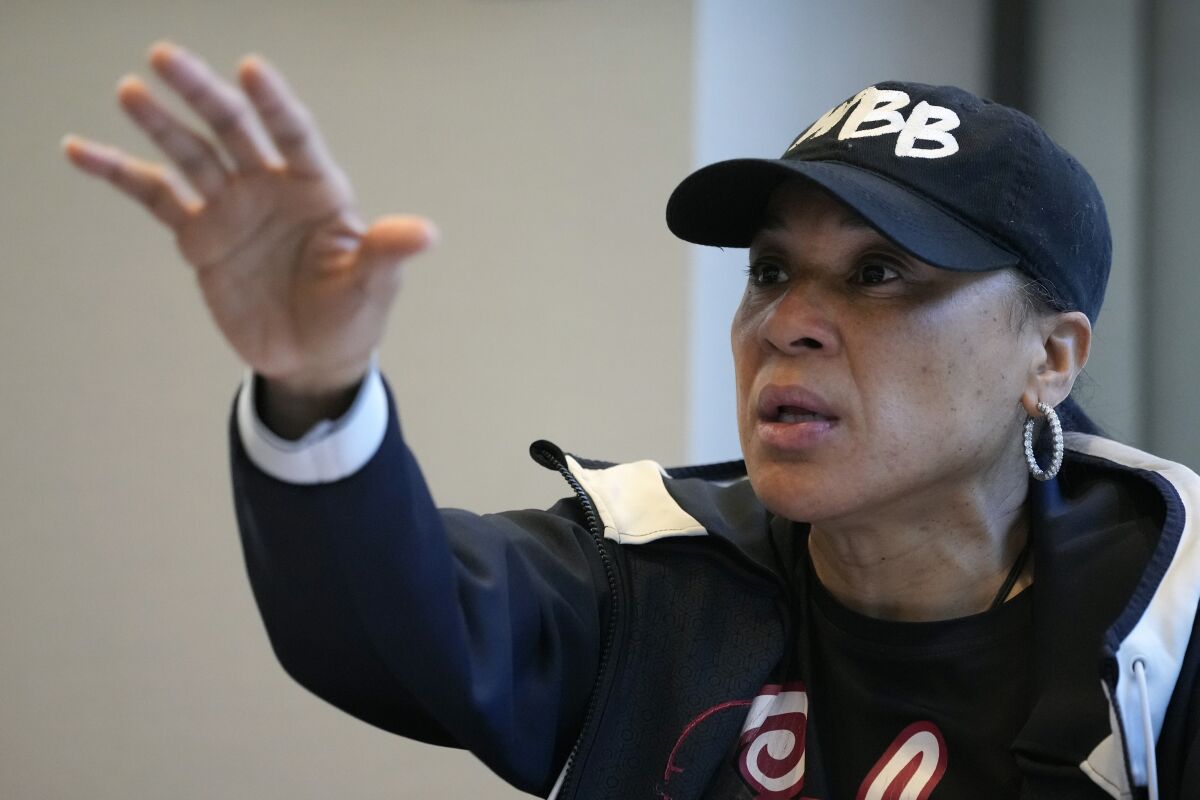 South Carolina head coach Dawn Staley speaks to her team during a film session at the Women's Final Four NCAA college basketball tournament, Saturday, April 2, 2022, in Minneapolis. The players found ways to enjoy their time in Minneapolis preparing for the women's Final Four and a shot at a second national title. (AP Photo/Charlie Neibergall)
