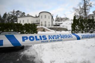 FILE - A police tape cordons an area outside a house where Swedish Security Service allegedly arrested two people on suspicions of espionage in a predawn operation in Stockholm, Tuesday, Nov. 22 2022. A Russian-born Swedish citizen, aged 60, was Monday, Aug. 28, 2023 charged with collecting information for the Russian military intelligence service GRU for almost a decade. Sergey Skvortsov was arrested in November together with his wife in a predawn operation in Nacka, outside Stockholm. (Fredrik Sandberg/TT News Agency via AP, File)