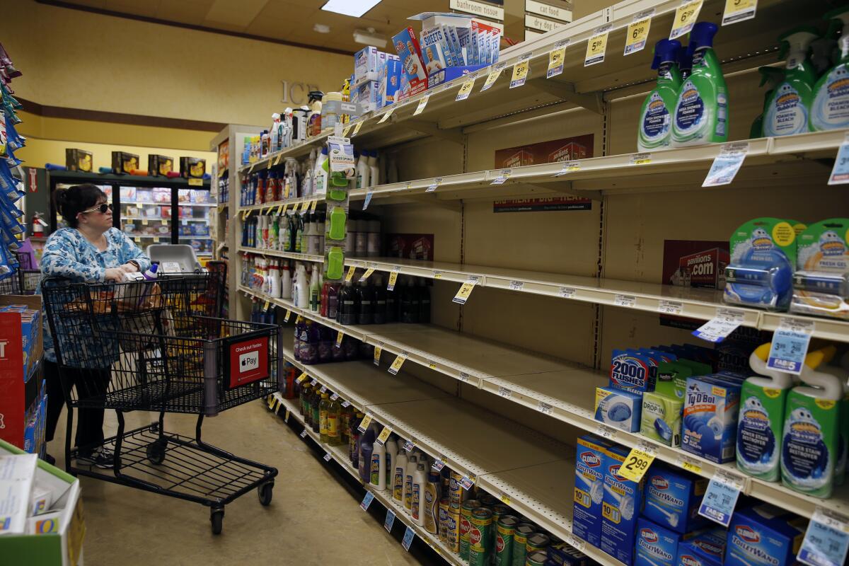 Hand sanitizer shelves are empty at a Pavilions supermarket in South Pasadena 