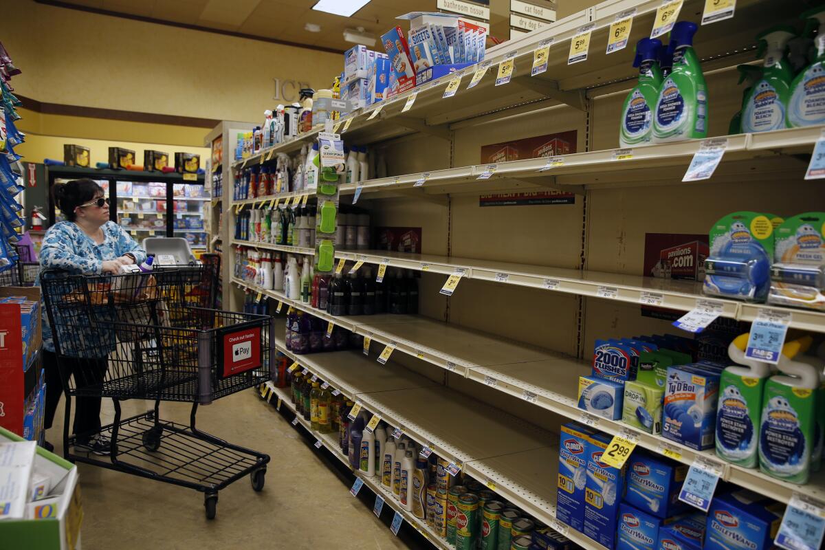 Hand sanitizer shelves are empty at a Pavilions supermarket in South Pasadena