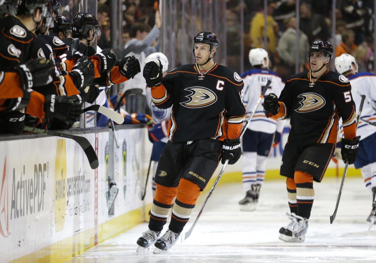Ryan Getzlaf celebrates with his teammates after scoring a goal against the Oilers in the third period of a game on Feb. 26.