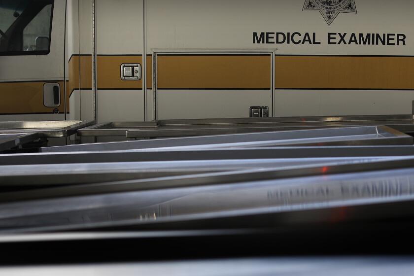 Gurneys line up at the San Diego County Medical Examiner's office. (Christina House / Los Angeles Times)