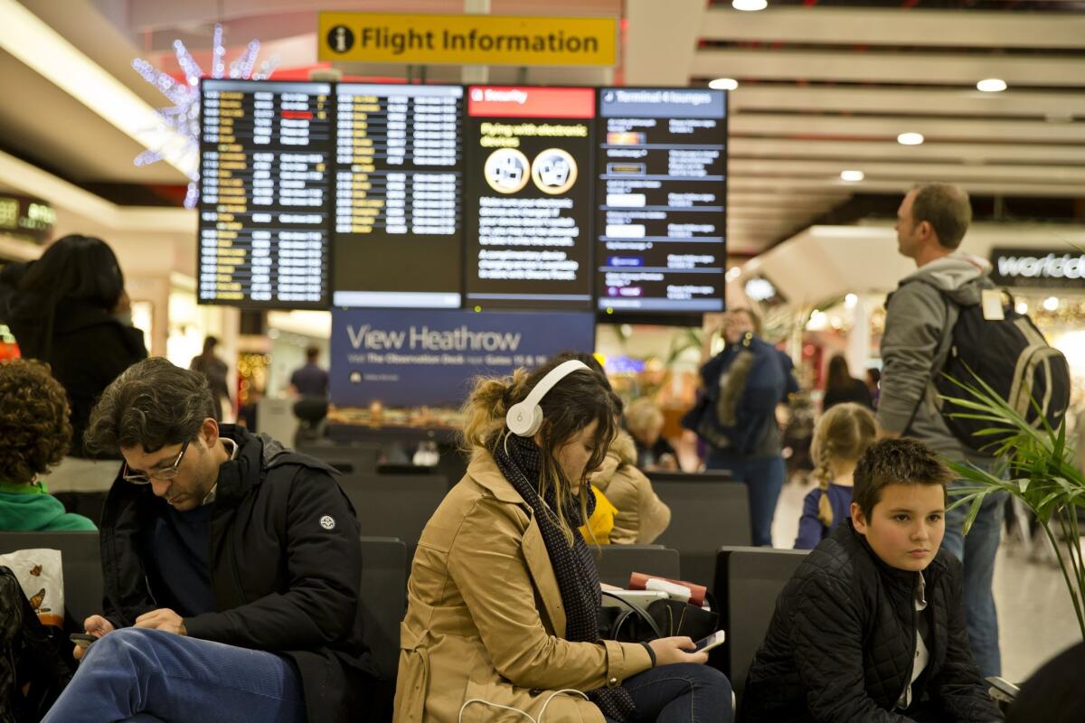 Passengers wait at London's Heathrow Airport after a technical failure at the British air traffic control service disrupted flights on Dec. 12.