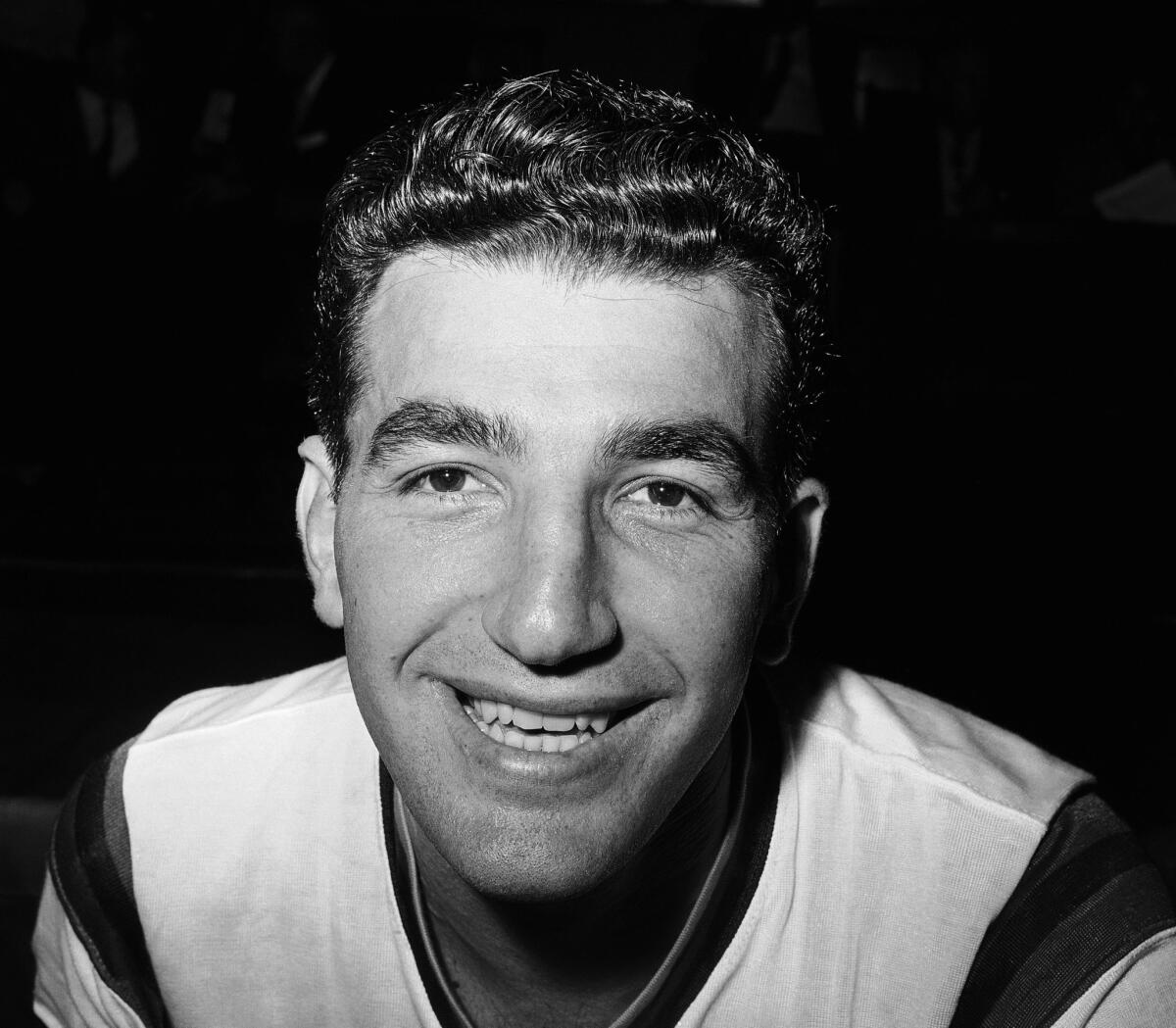 Syracuse Nationals center Dolph Schayes smiles in New York on Nov. 14, 1961. Schayes, a 12-time All-Star and NBA Hall of Famer, died at 87.
