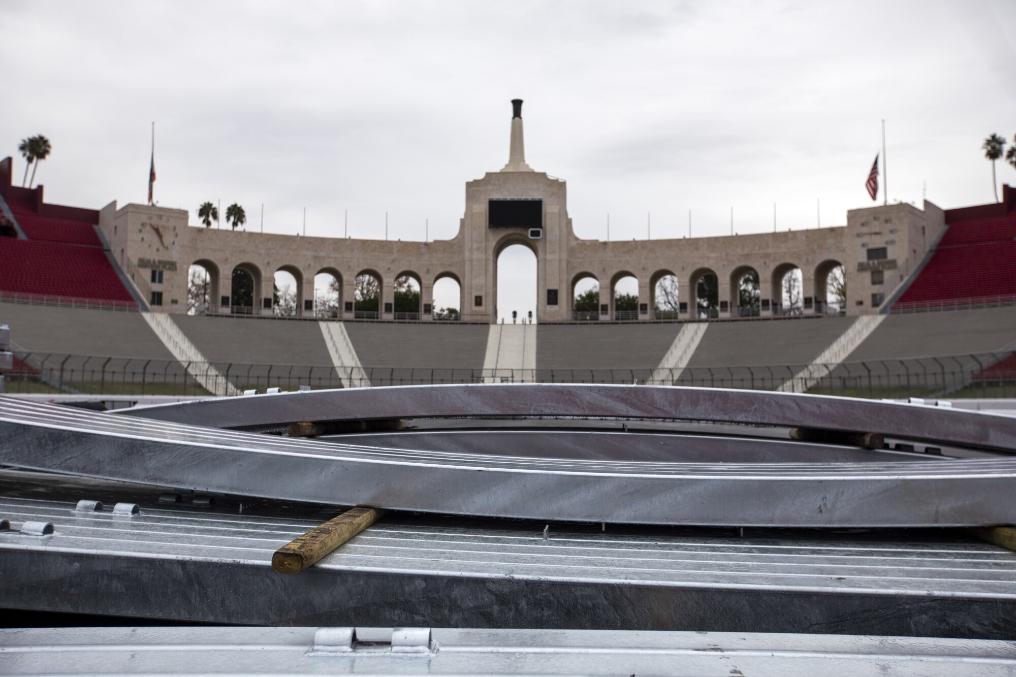 The SAFER barrier is in the field, while the Los Angeles Memorial Coliseum is being transformed into a racetrack.
