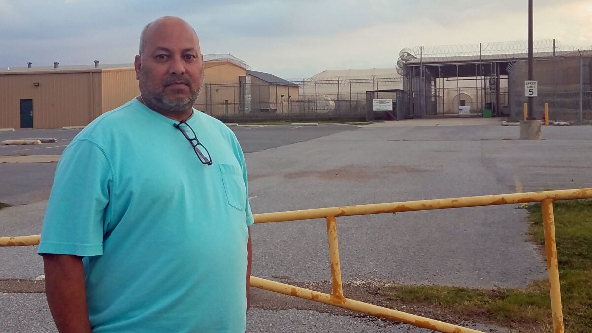 John Chavez, a former security guard at the Willacy County Correctional Center in Raymondville, Texas, stands outside the closed facility.