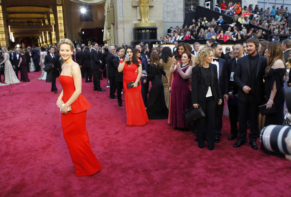 Jennifer Lawrence arrives at the 86th Annual Academy Awards on Sunday, March 2, 2014 at the Dolby Theatre at Hollywood & Highland Center in Hollywood, CA. (Wally Skalij / Los Angeles Times)