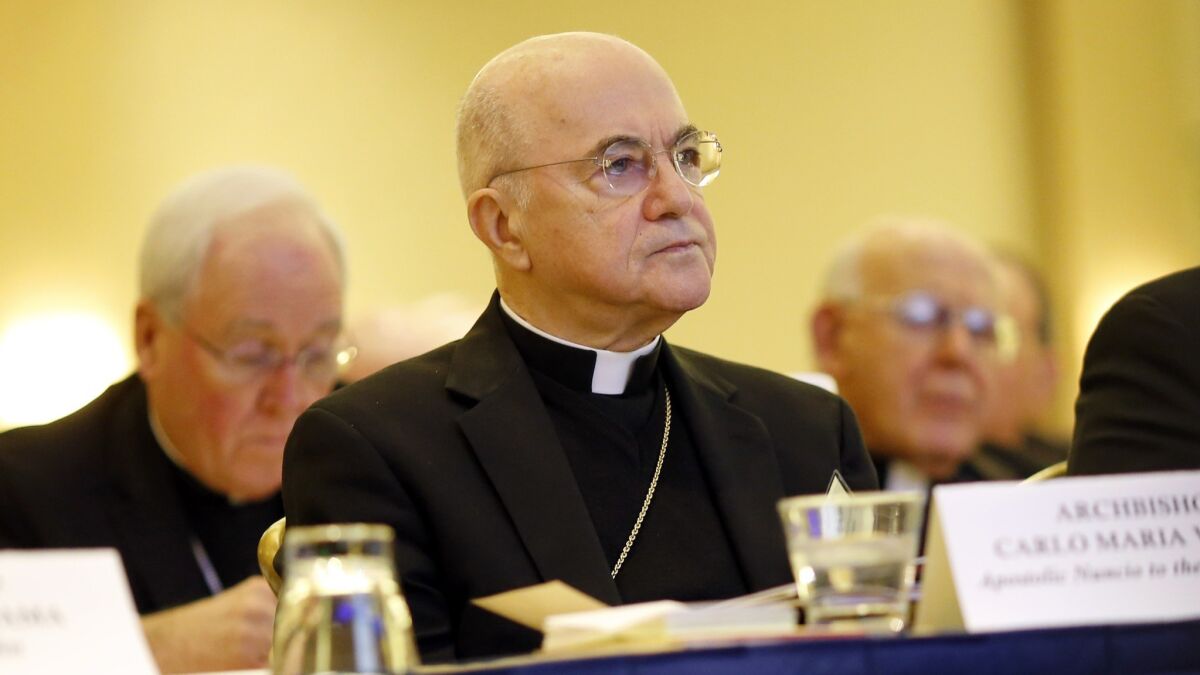 Archbishop Carlo Maria Vigano listens to remarks at the U.S. Conference of Catholic Bishops' annual fall meeting in 2015 in Baltimore.