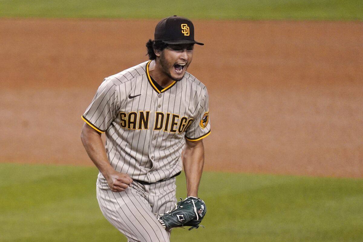 San Diego Padres starting pitcher Yu Darvish celebrates after striking out Dodgers first baseman Edwin Rios.