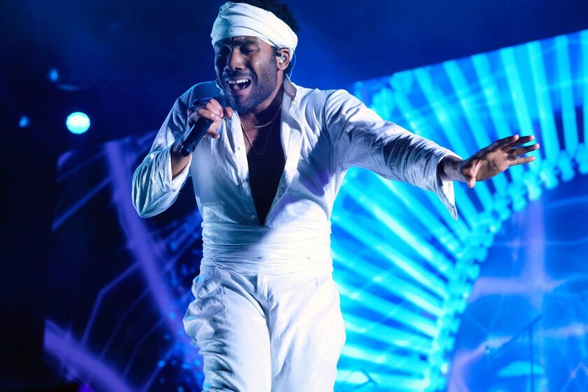 FILE - In this June 3, 2017, file photo, Donald Glover, who goes by the stage name Childish Gambino, performs at the Governors Ball Music Festival in New York. Childish Gambino was nominated for five Grammy nominations on Tuesday, Nov. 28. The 60th Annual Grammy Awards will air on CBS, Sunday, Jan. 28, 2018 in New York. (Photo by Charles Sykes/Invision/AP, File)