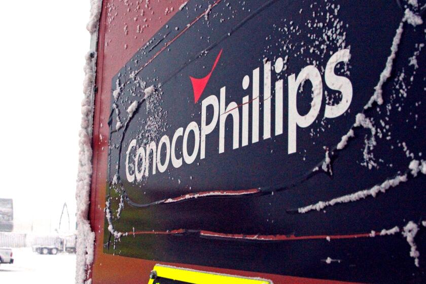 An ice-covered ConocoPhillips sign at the Colville-Delta 5 drilling site on Alaska's North Slope in 2016.