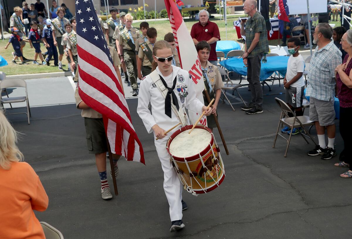 Drummer Christian Redman leads the Boy Scouts of America Troop 339 color guard.