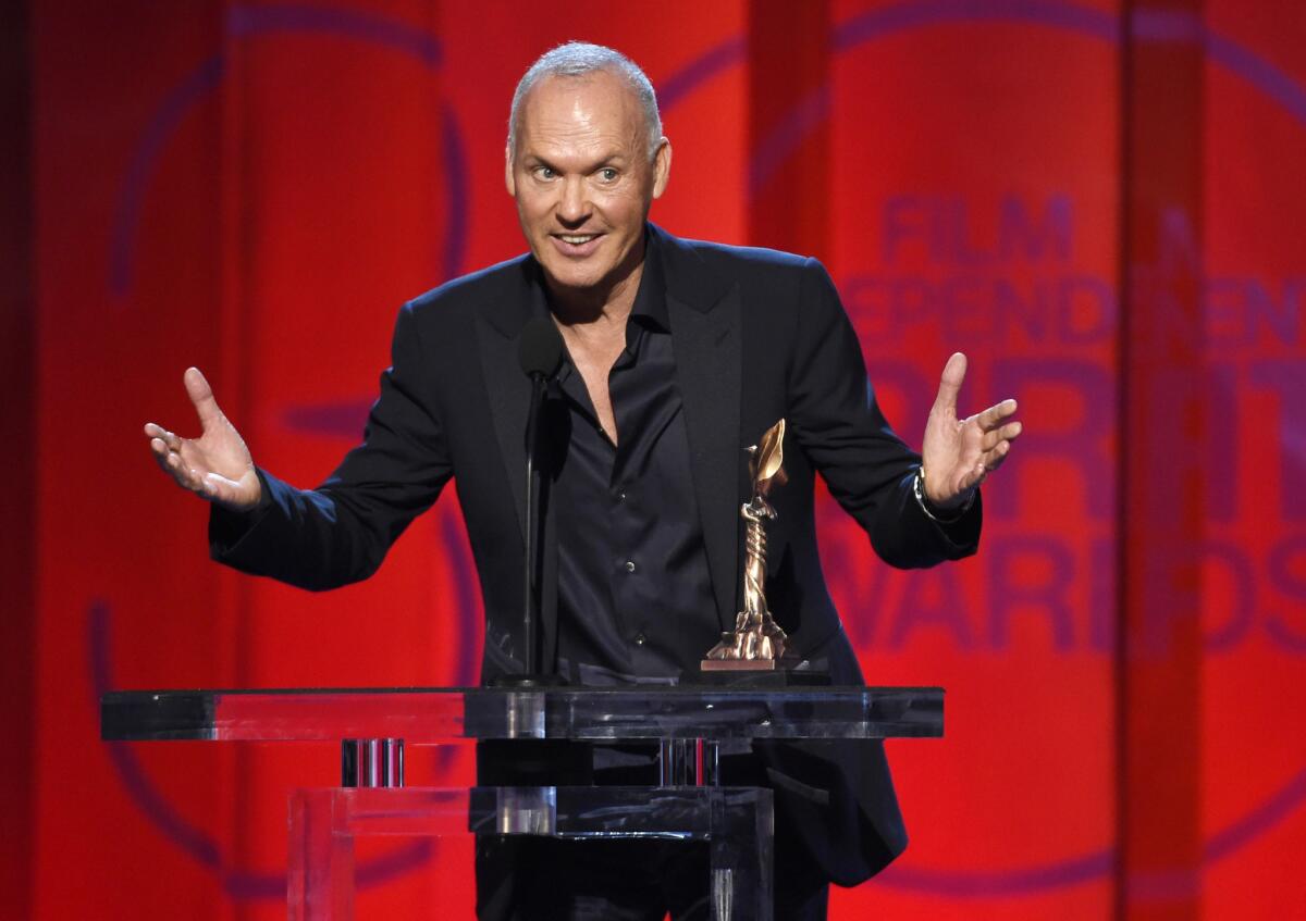 Michael Keaton accepts the award for best male lead for "Birdman" at the Independent Spirit Awards.