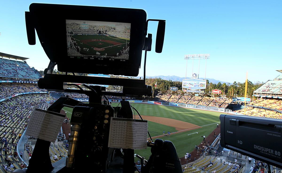 A television camera is trained on the field at Dodger Stadium for the game between the Dodgers and Angels on Monday, Aug. 4, 2014.