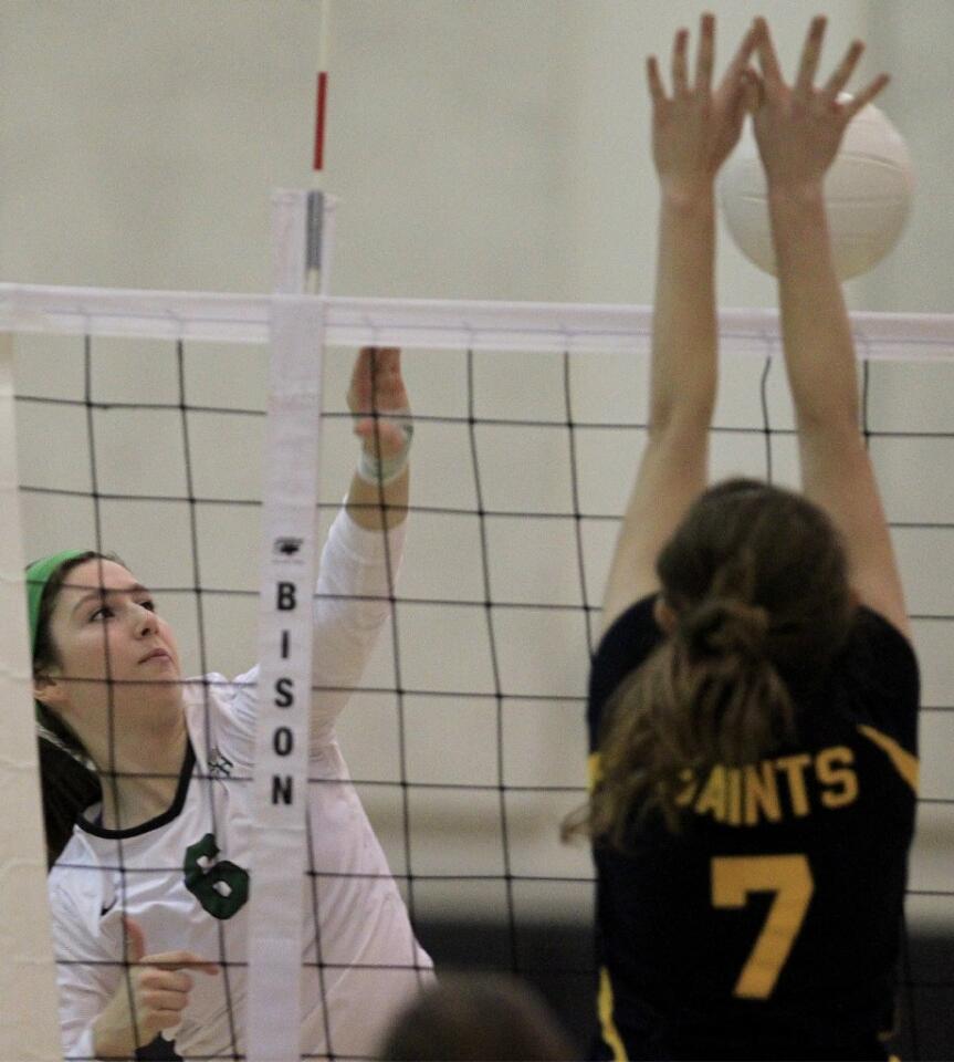 Sage Hill School's Sophie Gordon (6) battles at the net against Crean Lutheran's Danielle Straka (7) during the first set in a CIF State Southern California Regional Division III semifinal match on Saturday. The Lightning beat the Saints in three straight sets.
