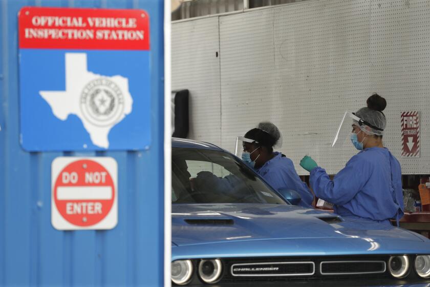 COVID-19 antibody testing and diagnostic testing are administered at a converted vehicle inspection station, Tuesday, July 7, 2020, in San Antonio. Local officials across Texas say their hospitals are becoming increasingly stretched and are in danger of becoming overrun as cases of the coronavirus surge. (AP Photo/Eric Gay)