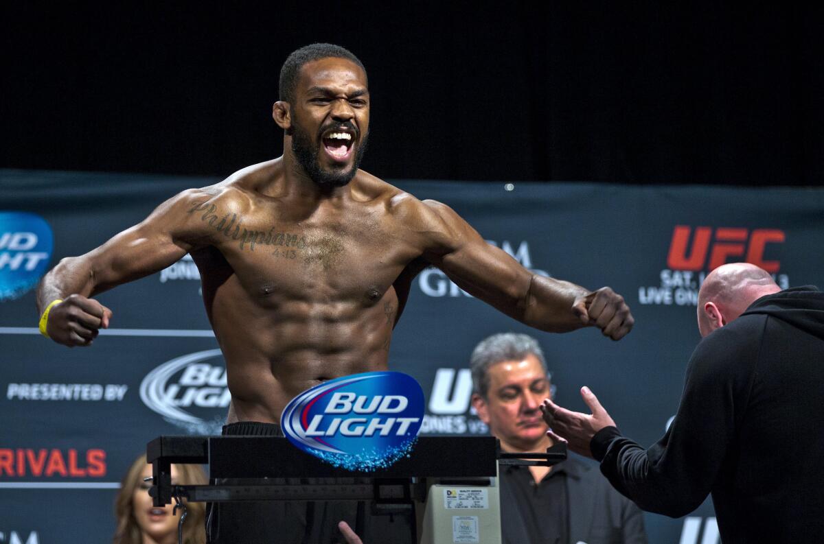 UFC fighter Jon Jones poses for fans during a weigh-in on Jan. 2 before his bout with Daniel Cormier.