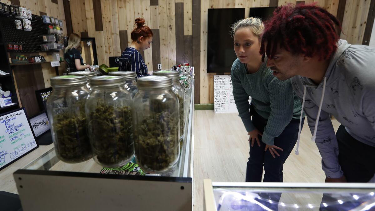 Olivia Juliano, left, and Morgan Nettles at Greenlight Discount Pharmacy, a marijuana shop in Sylmar, in April.