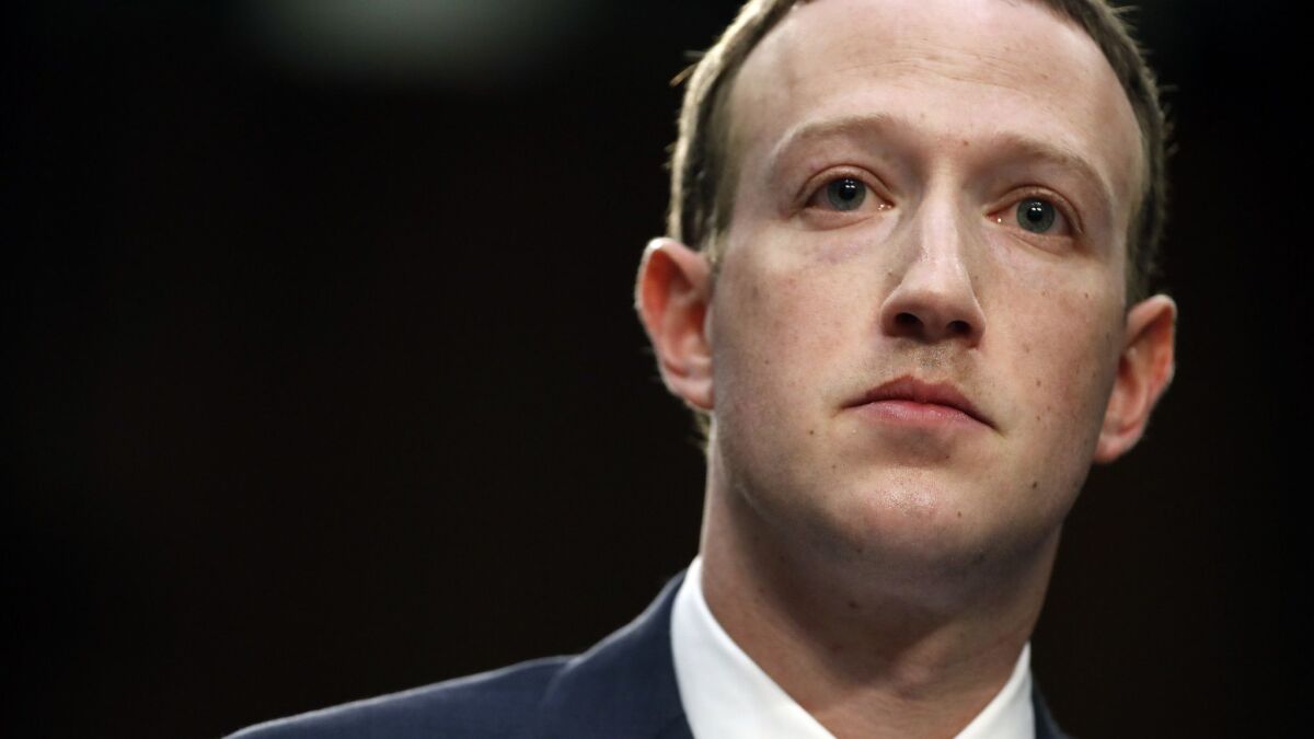 Facebook CEO Mark Zuckerberg testifies before a joint hearing of the Commerce and Judiciary committees in Washington on April 10.