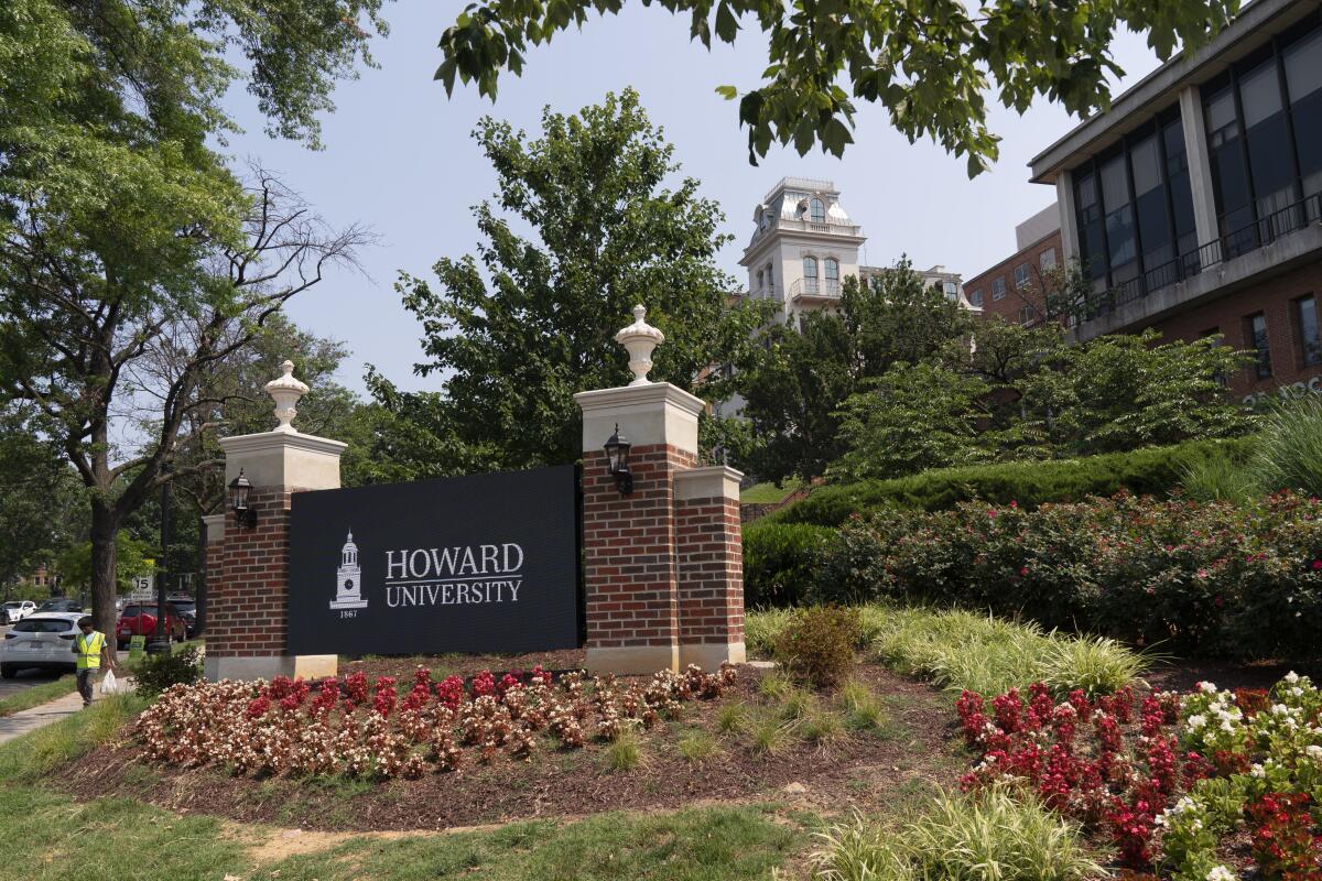 Flowers sit around an electronic signboard that says Howard University.