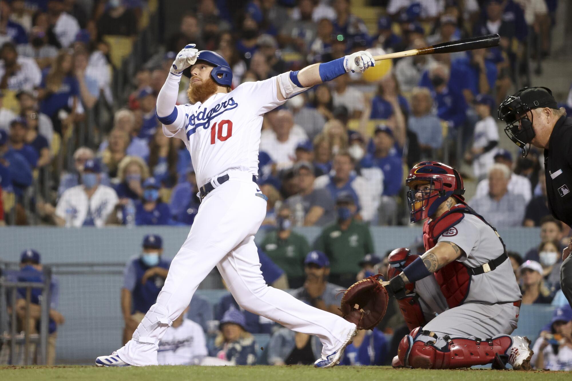 Los Angeles Dodgers' Justin Turner follows through on a swing for a solo home run