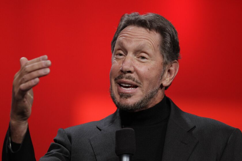 FILE - In this Oct. 2, 2012 file photo, Oracle CEO Larry Ellison gestures while giving a keynote address at Oracle OpenWorld in San Francisco. Oracle says Ellison is stepping aside as CEO of the company he founded. The business software maker promoted Safra Catz and Mark Hurd to replace him as co-CEOs. (AP Photo/Eric Risberg, File)