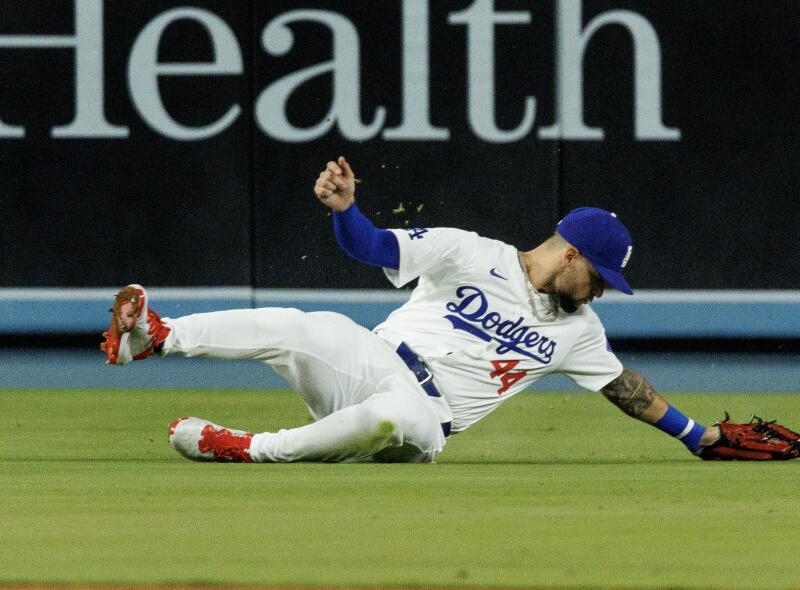 Dodgers center fielder Andy Pages makes a sliding catch in the seventh inning.