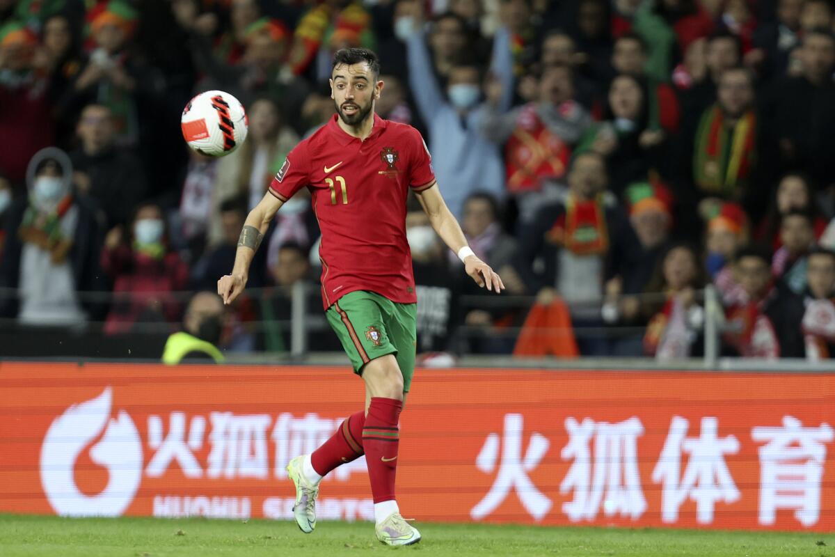 Portugal's Bruno Fernandes eyes the ball during the World Cup 2022 playoff soccer match between Portugal and North Macedonia, at the Dragao stadium in Porto, Portugal, Tuesday, March 29, 2022. (AP Photo/Luis Vieira)