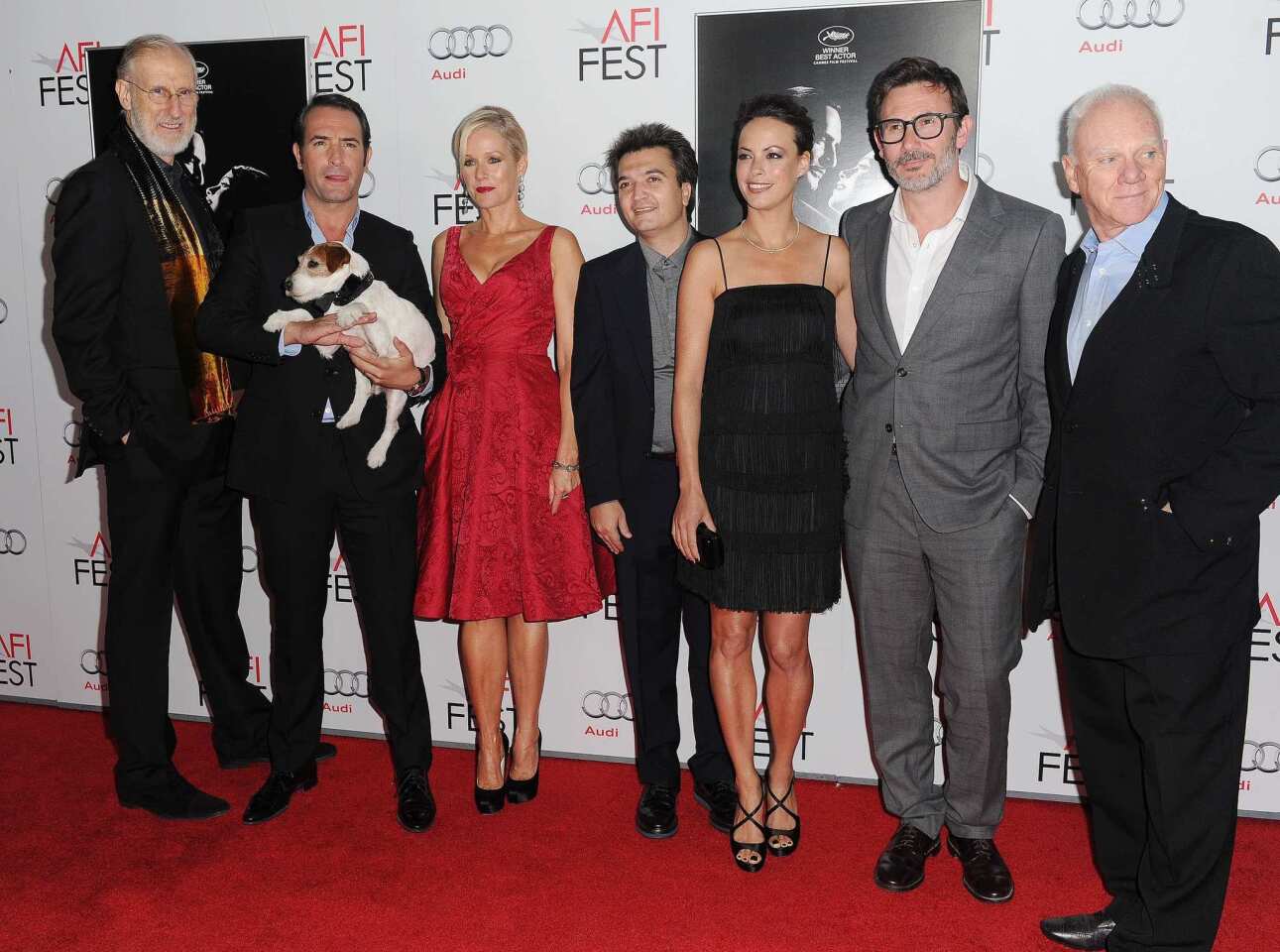 "The Artist" actors, from left, James Cromwell, Jean Dujardin, Uggie the dog, Penelope Ann Miller, a guest, Berenice Bejo, director Michel Hazanavicius and Malcom McDowell attend the gala screening of their silent film at Grauman's Chinese Theatre during the AFI Film Festival.