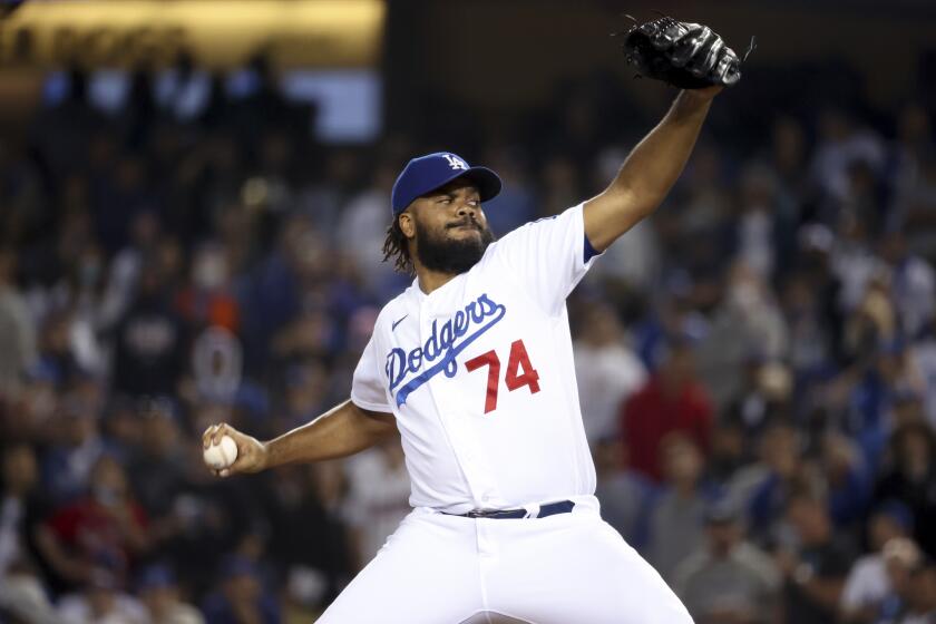 Los Angeles, CA - October 21: Los Angeles Dodgers relief pitcher Kenley Jansen delivers a pitch during the ninth inning in game five in the 2021 National League Championship Series against the Atlanta Braves at Dodger Stadium on Thursday, Oct. 21, 2021 in Los Angeles, CA. (Robert Gauthier / Los Angeles Times)