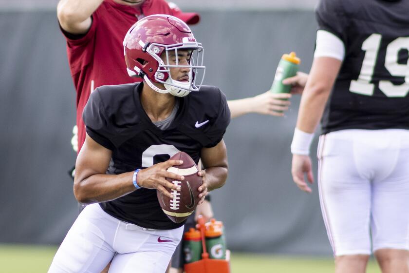 Alabama quarterback Bryce Young (9) rolls out on a passing drill during the NCAA college football team's practice Thursday, Aug. 12, 2021, in Tuscaloosa, Ala. (AP Photo/Vasha Hunt)