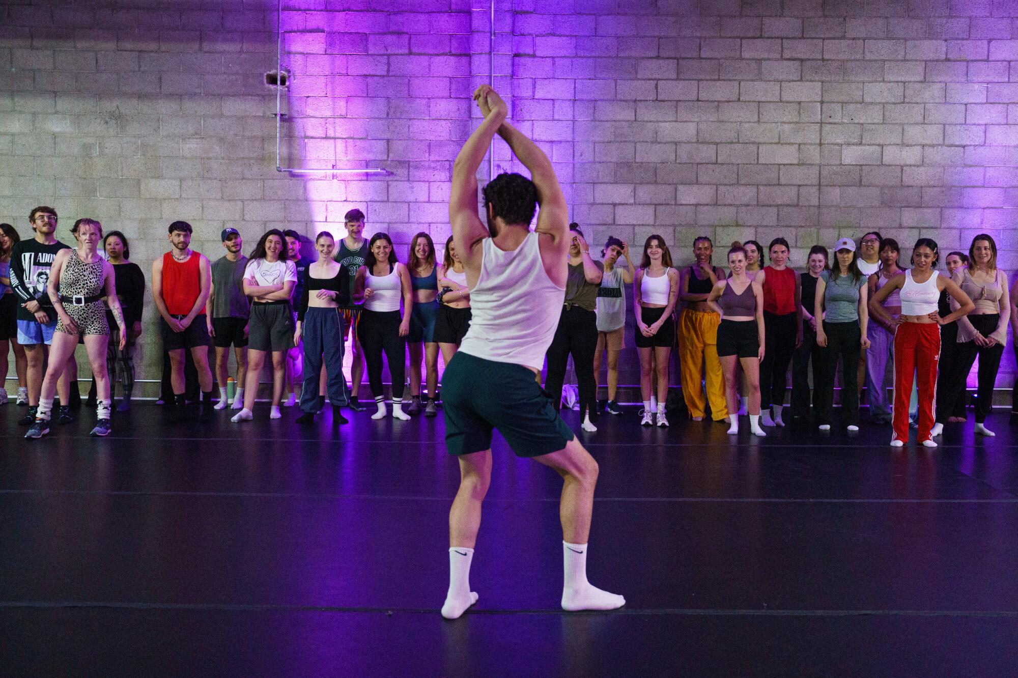 Alec Cohen teaching a dance class.