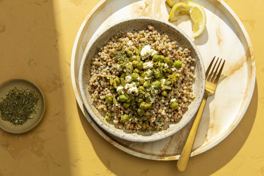 LOS ANGELES, CALIFORNIA, Aug. 25, 2021: Couscous with Fresh Garbanzos and Bulgarian feta with Alguashte Dukkah for the September Week of Meals collumn by Ben Mims, photographed on Wednesday, Aug. 25, 2021, at Proplink Studios in Arts District Los Angeles. (Photo and Prop Styling / Silvia Razgova / For the Times) ATTN: 829341-la-fo-week-of-meals-september-2021