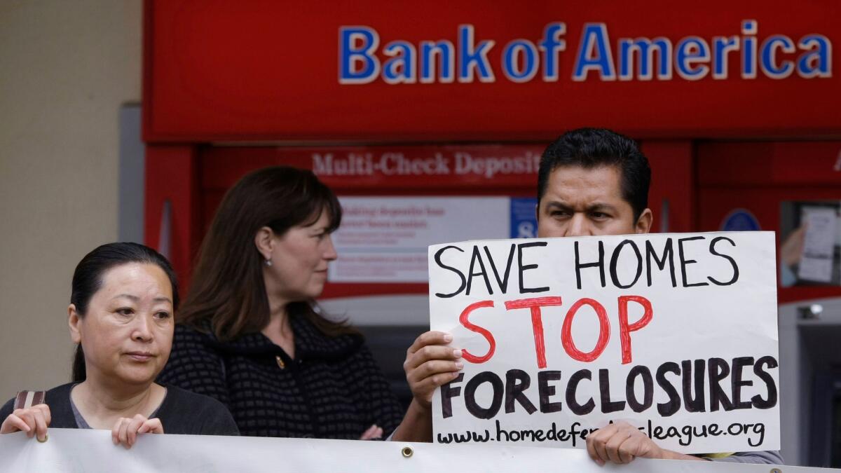 Activists rally in front of a Bank of America in San Jose in 2011 to protest mortgage foreclosures.