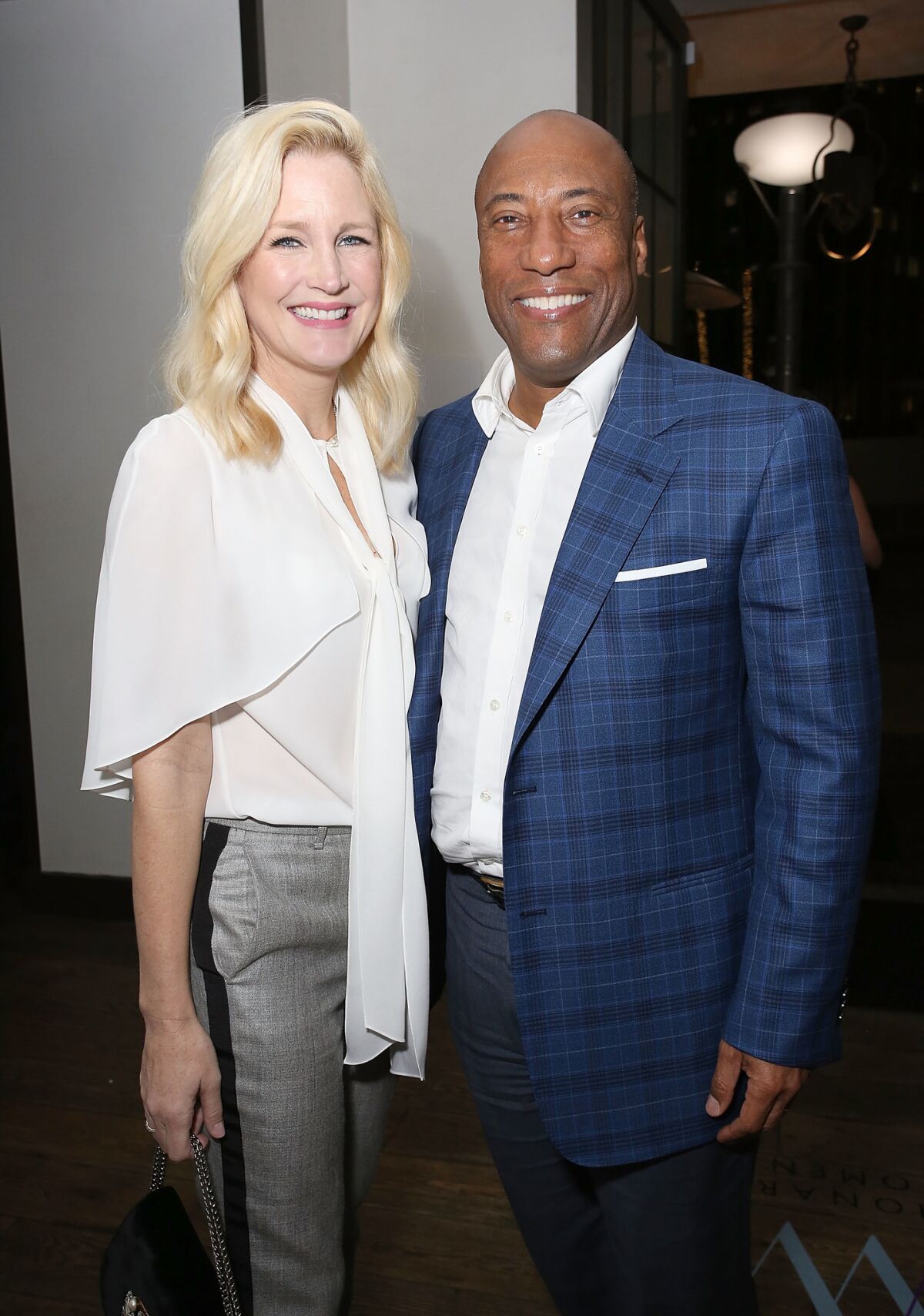 Jennifer Lucas, left, and Byron Allen at the Visionary Women's International Women's Day event.