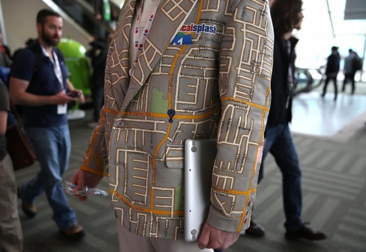 An attendee at Google's annual developers conference in San Francisco wears a custom Google Maps leather coat.