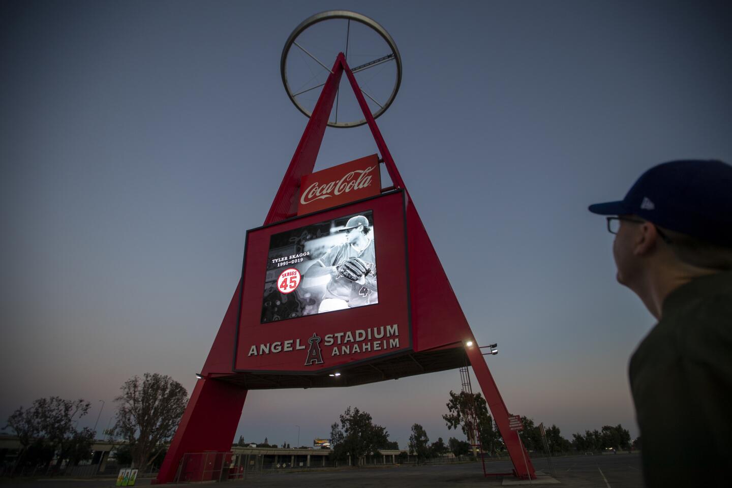 Tim McCann, of Anaheim, views a memorial to Angels pitcher Tyler Skaggs on The Big A at Angel Stadium.