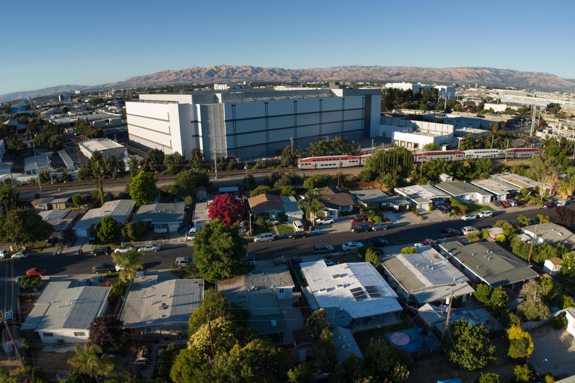 A Santa Clara neighborhood sits in the shadow of a large data center.